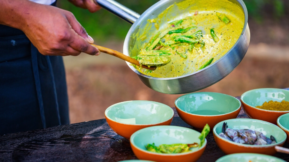 caterer preparing curry for the funeral guests