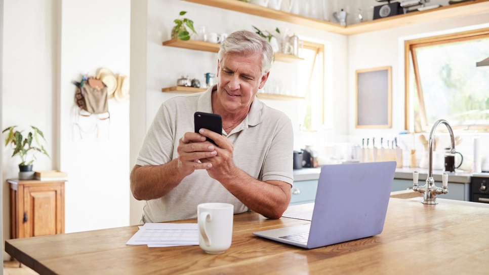 A satisfied Procompare client getting accounting firms quotes via mobile phone.