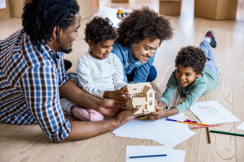 Happy black family in their home.