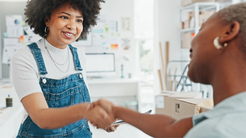 Client and a reliable professional shake hands.