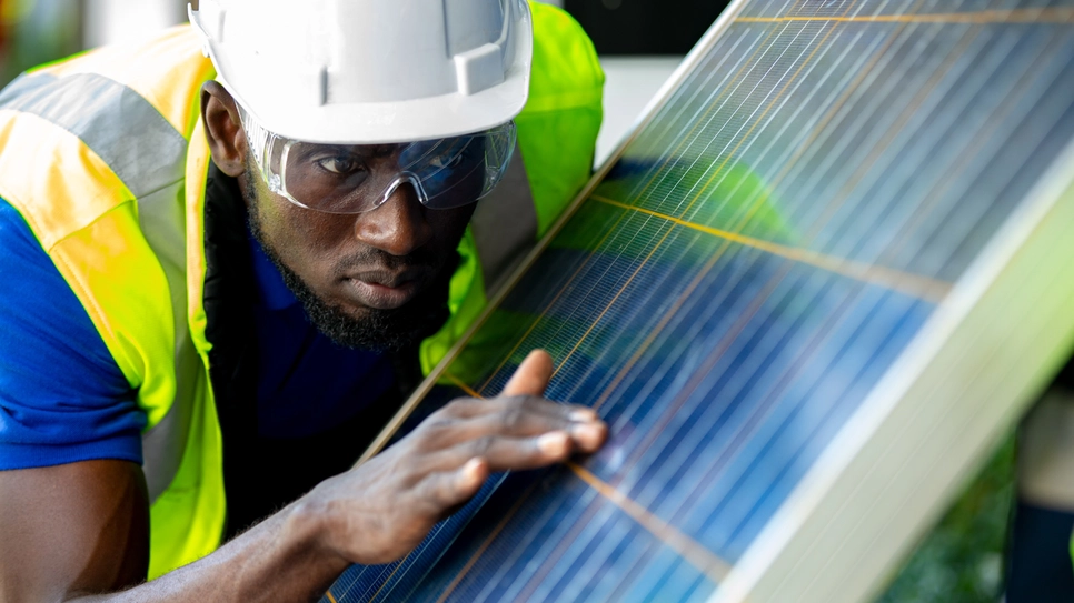 Procompare's solar panel repair professional checking the panel.