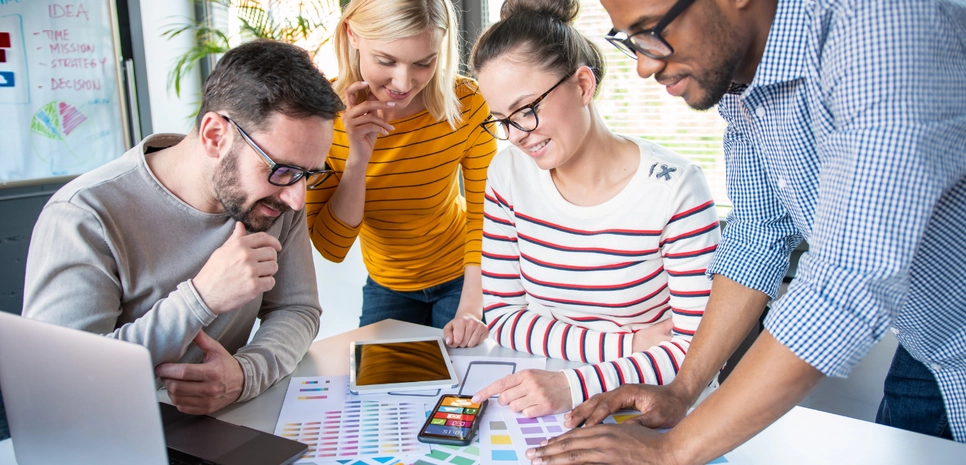 Couple of people choosing colours for a website.